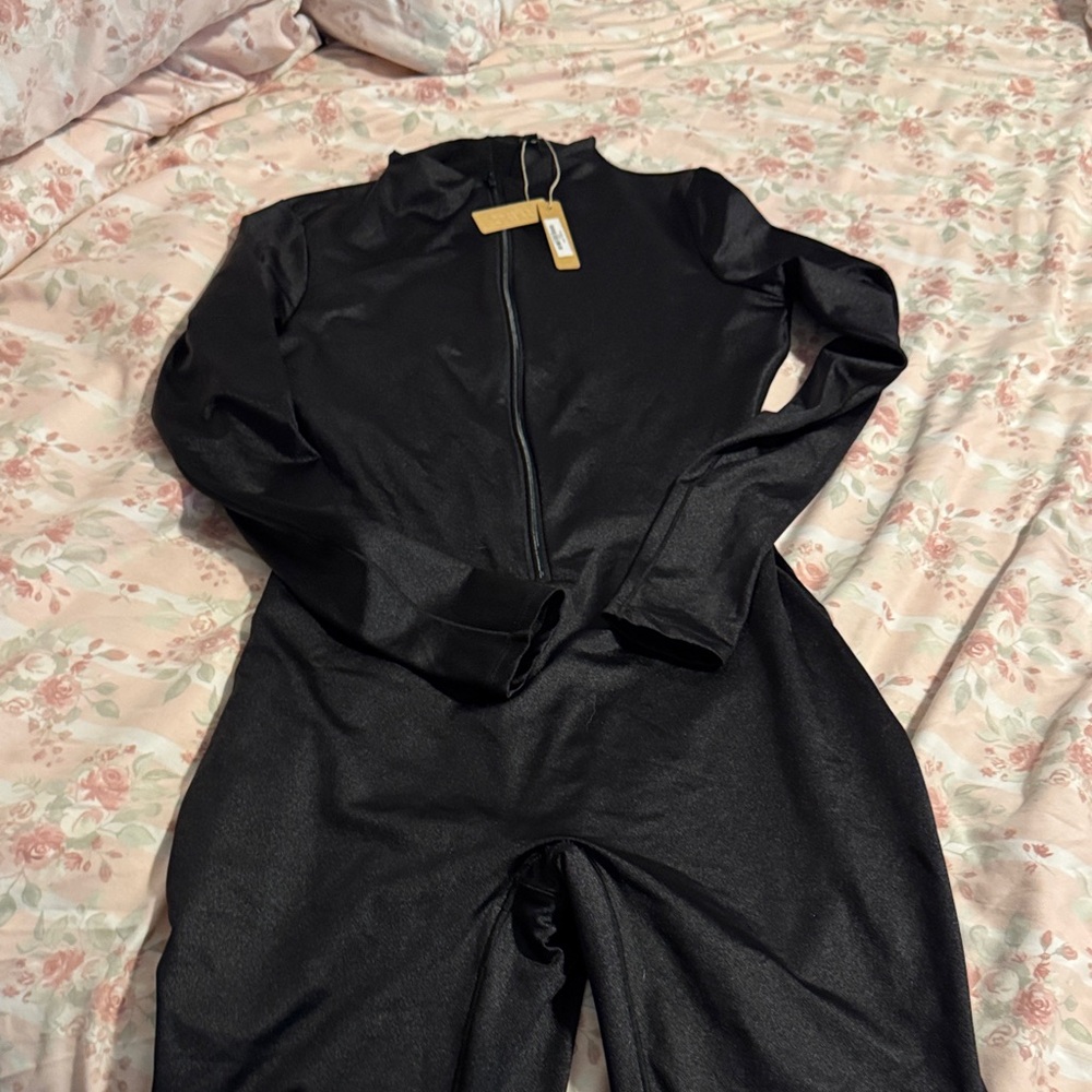 Skims , all in one cat suit, front zipper size large, NWT